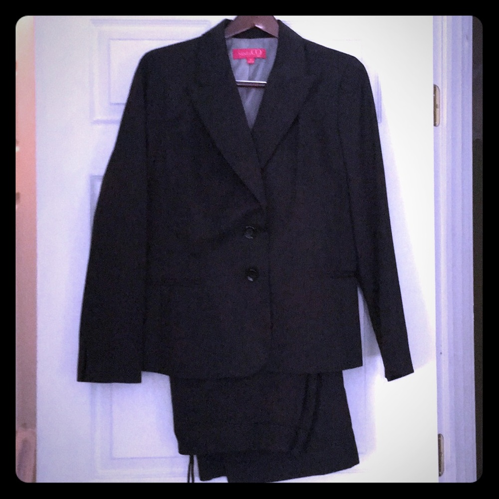 Black pin striped suit.